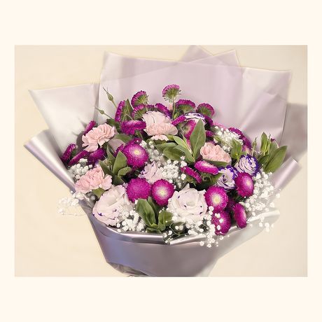 Magenta pompoms and pink carnations in a grey wrap